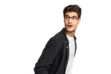 Young caucasian handsome man isolated looks aside smiling, cheerful and pleasant.