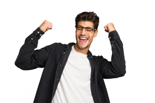 Young caucasian handsome man isolated raising fist after a victory, winner concept.