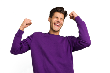 Young caucasian handsome man isolated raising fist after a victory, winner concept.