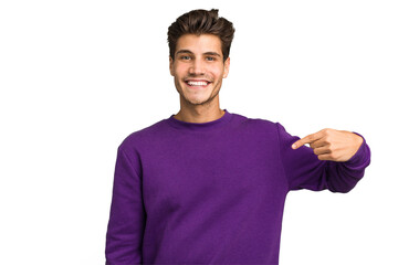 Young caucasian handsome man isolated person pointing by hand to a shirt copy space, proud and...