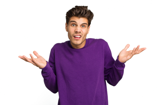 Young caucasian handsome man isolated doubting and shrugging shoulders in questioning gesture.