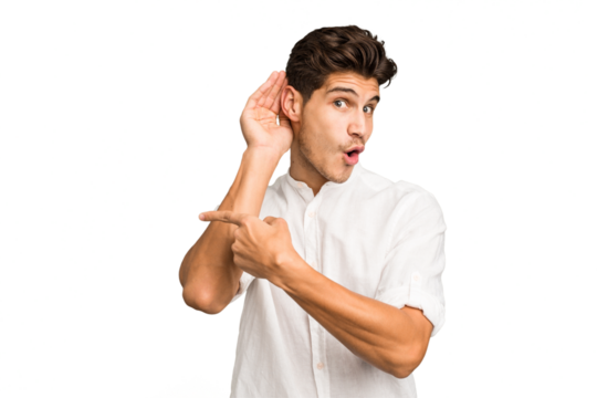 Young caucasian handsome man isolated trying to listening a gossip.