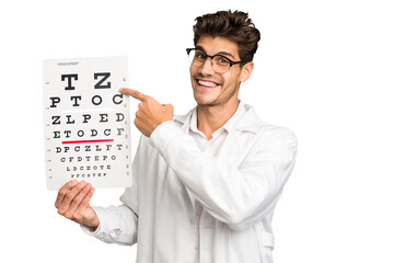 Young caucasian oculist man holding a optometry test isolated