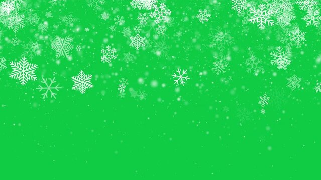 falling snow flakes overlay on green background