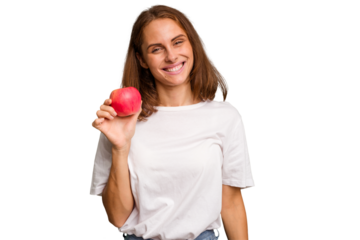Young caucasian woman holding a red apple isolated happy, smiling and cheerful.