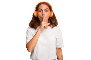 Young caucasian woman listening to music with headphones isolated keeping a secret or asking for...