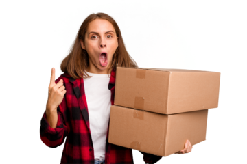 Young caucasian woman moving while picking up a box full of things isolated having an idea, inspiration concept.