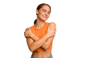 Young caucasian woman isolated hugs, smiling carefree and happy.