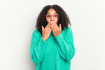 Young african american woman isolated on white background shocked, covering mouth with hands, anxious to discover something new.