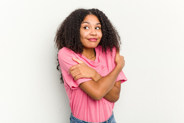 Young african american woman isolated on white background hugs, smiling carefree and happy.