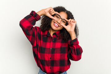 Young african american woman isolated on white background showing okay sign over eyes