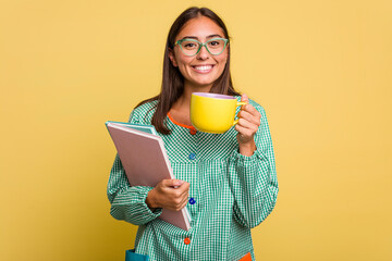 Young caucasian child education teacher drinking a coffee in a time break isolated