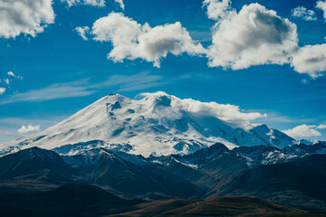 Big mountain Elbrus. Snow covered Greater Caucasus mountains. The two peaks of Mount Elbrus . Europe's highest peak. Journey to Kabardino-Balkaria. Russia.