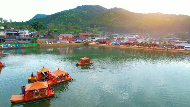 Drone is flying over a Chinese village in Thailand, &ldquo;Ban Rak Thai&rdquo; Lake early morning. Famous tourist attractions in Thailand. aerial view. Mae Hong Son, Northern Thailand. Southeast asia. 4K
