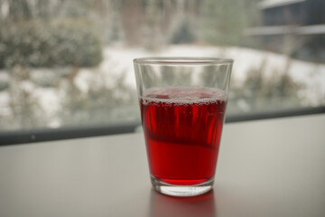 A glass of homemade currant juice, closeup image