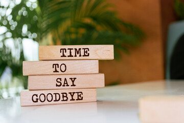 Wooden blocks with words 'Time to say goodbye'.