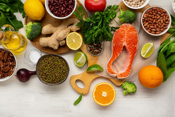 Uncooked fish fillet and spice cooking ingredients top view