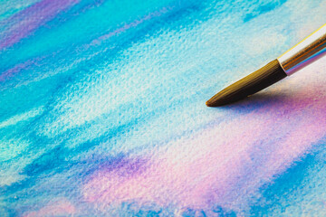 Abstract Hand painted Watercolor Colorful wet texture background with paint brushes on paper. picture for creative wallpaper or design art work. Pastel colors tone