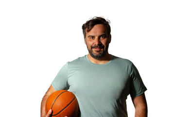 Basketball player holding a ball posing on a white background