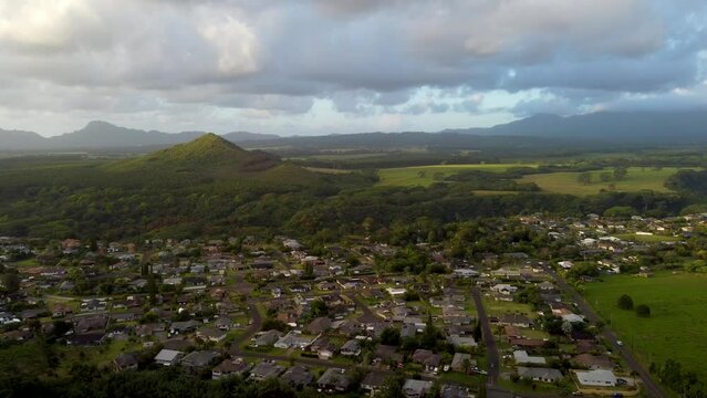 Aerial mountain sunrise footage. Epic cinematic nature aerial view of houses of Kauai island, Hawaii, USA. Kapaa town. 4k .