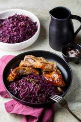 Braised red cabbage with roasted pork ribs. German food tradition. Vertical image.