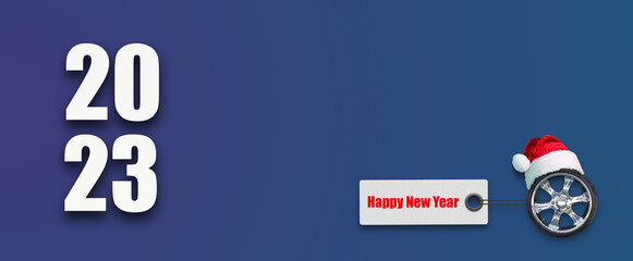 2023. Auto wheel in Santa hat and Happy New Year banner, on a blue background. copy space. Christmas
