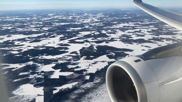 View from airplane windows during landing at Helsinki airport, Finland
