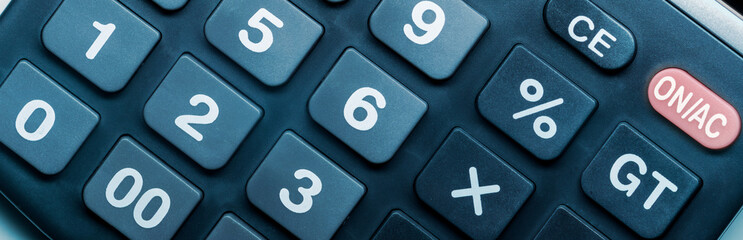 Panorama of calculator keyboard buttons, close-up. Basic symbols of algebra, simple mathematical nomenclature.