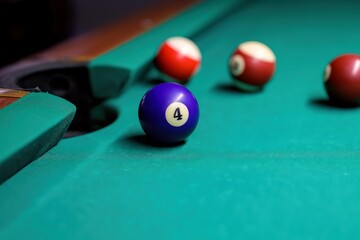 Billiard balls on the green table. billiard balls in front of the pocket.