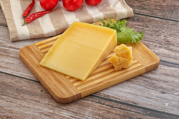 Parmesan hard cheese with small pieces