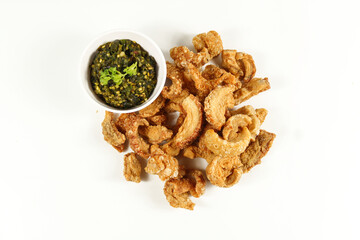 Homemade crispy pork rind with green chili paste. Local food of northern Thailand.