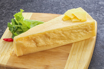 Parmesan cheese piece over board