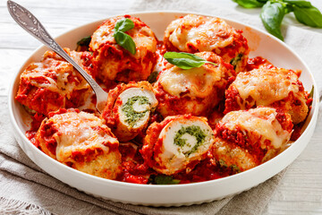 tasty chicken rollatini in tomato sauce, top view