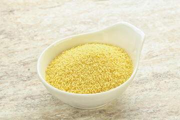Raw couscous in the bowl