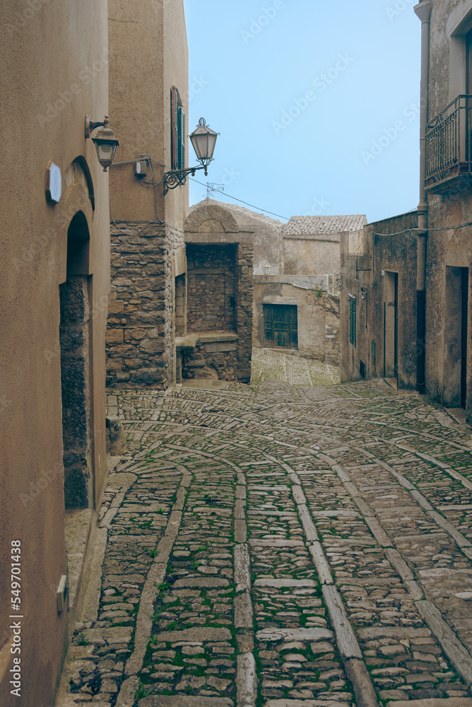 Wall mural narrow stone lane in erice.