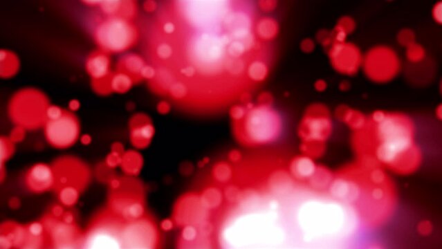 Beautiful festive bokeh effect, red love circles of light shining falling falling glowing christmas new year on black background. Abstract background. Screensaver, video in high quality 4k