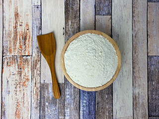 A wooden bowl of flour