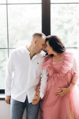 Happy family expecting a baby, concept of support and care