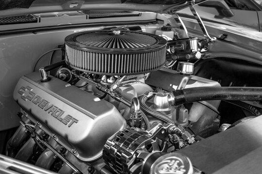 Grayscale shot of a Chevrolet custom-built motor vehicle