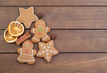 Traditional christmas gingerbread cookies over a wooden table with copy space