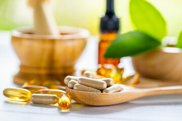 Alternative medicine herbal organic capsule with vitamin E omega 3 fish oil, mineral, drug with herbs leaf natural supplements for healthy good life.