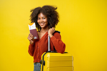 Portrait of young attractive traveling african american woman curly hair with baggage passport and...