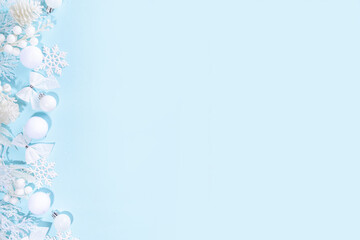 White and blue Christmas background, White Christmas concept. Merry Xmas, New Year Happy Holidays greeting card, frame, banner. Noel. Festive white branches, decor, ornaments, blue background top view