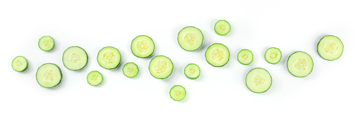 Fresh cucumber slices on a white background panorama, overhead flat lay shot. Healthy organic food panoramic banner