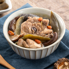 Delicious Taiwanese peeled green chili pepper chicken soup with mushroom and goji berry.