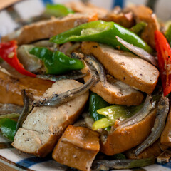Homemade stir-fried dried beancurd with dried fish and green chili.