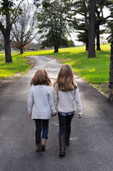 Sisters Walking Along a Path