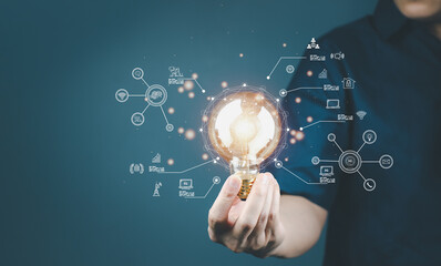Man holding light bulb searching technology future digital world strategy, digitization and...