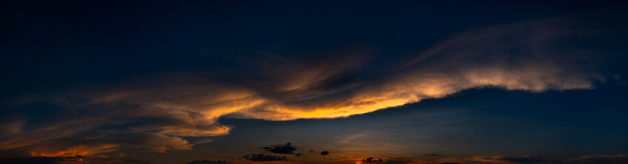 Panorama vivid and dark sky.Panorama of a twilight sunset and colorful clouds - sunlight with dramatic cloud.Panoramic Evening Orange dark sky.