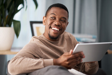 Black man, digital tablet and social media, living room home and streaming app, reading ebook or online shopping on technology. Happy guy, wifi connection and relax in lounge, wifi internet and ideas